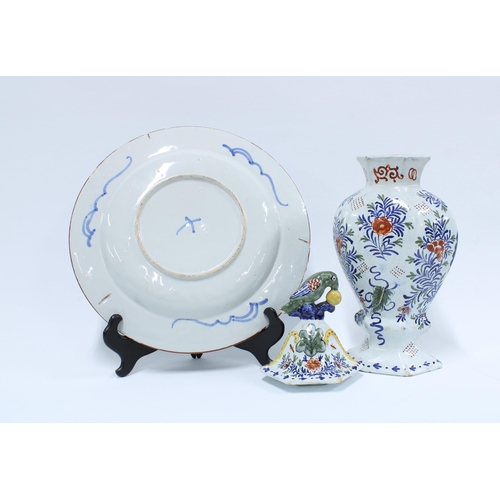 374 - Delft polychrome vase and cover and a Delft blue and white plate, 31cm diameter (2)