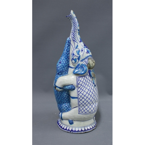 390 - Turquoise blue and white glazed  pottery elephant  and crocodile figure group (trunk a/f) 43cm