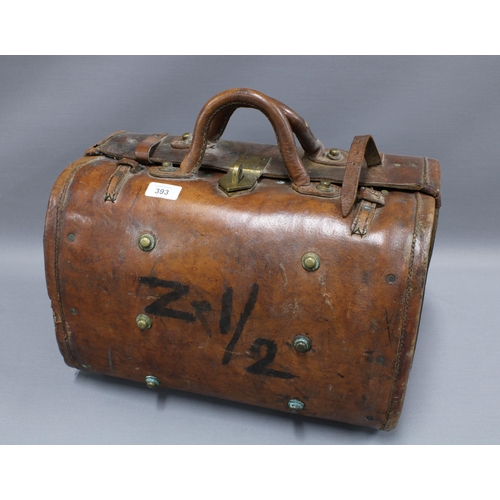 393 - Early 20th century Indian brown leather carry case with interior pockets, brass studs and fittings, ... 