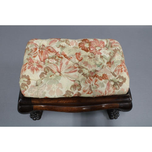 399 - Mahogany footstool with paw feet and floral buttoned seat, 25 x 41 x 28cm