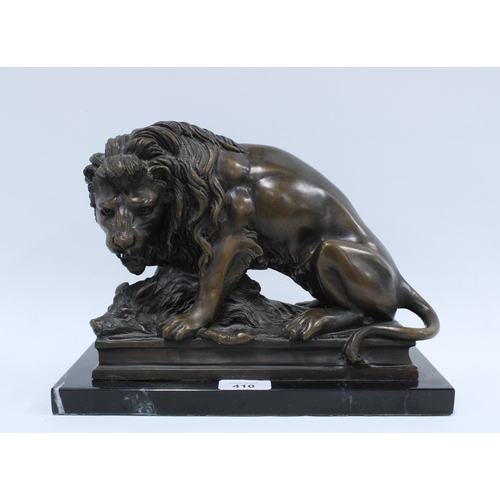 410 - Lion and Boar bronze study, modern production on a black plinth base, 30 x 21cm