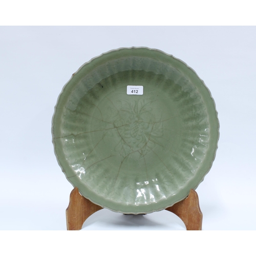 412 - Antique Chinese celadon glazed charger with lobed edge and incised pattern of foliage, star crack in... 