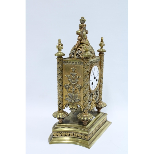 413 - Gilt metal mantle clock, the enamel dial flanked by pierced pilasters, brass movement numbered 7791,... 