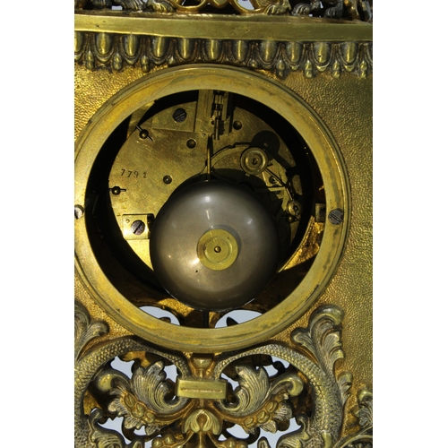 413 - Gilt metal mantle clock, the enamel dial flanked by pierced pilasters, brass movement numbered 7791,... 