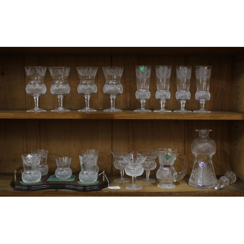 414 - A part suite of Edinburgh Crystal thistle etched glass to include a decanter and stopper, small wate... 