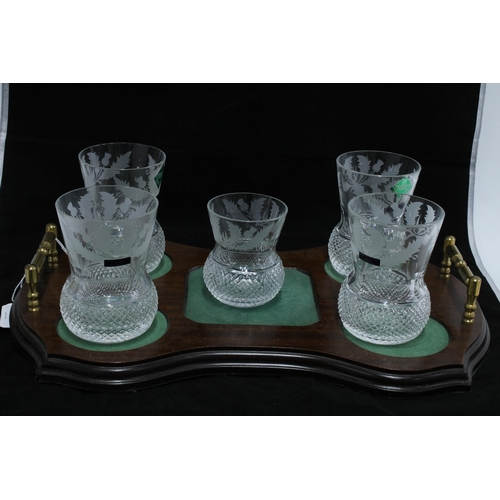 414 - A part suite of Edinburgh Crystal thistle etched glass to include a decanter and stopper, small wate... 