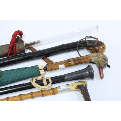 418 - Collection of vintage parasols, walking canes and a riding crop, (5)