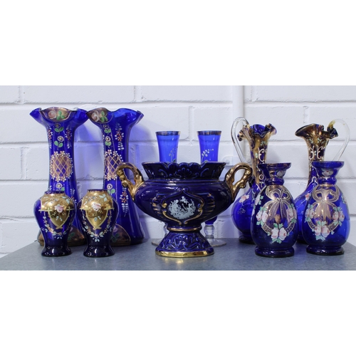 429 - A large collection of Bohemian blue glass, (over two shelves) (24)