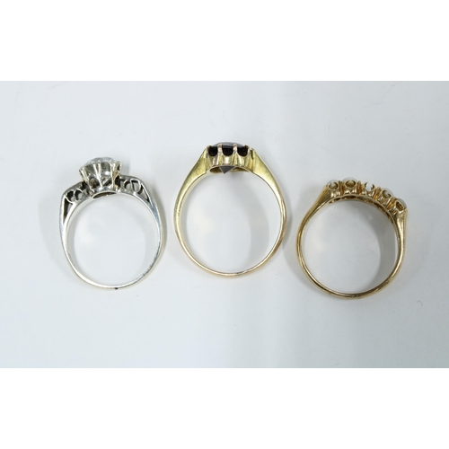 44 - three dress rings to include an 18ct gold ring with pearls (one missing), 9ct gold solitaire ring an... 