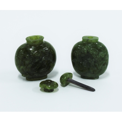 449 - Two Chinese carved jadeite snuff bottles with stoppers, 6cm high (2)