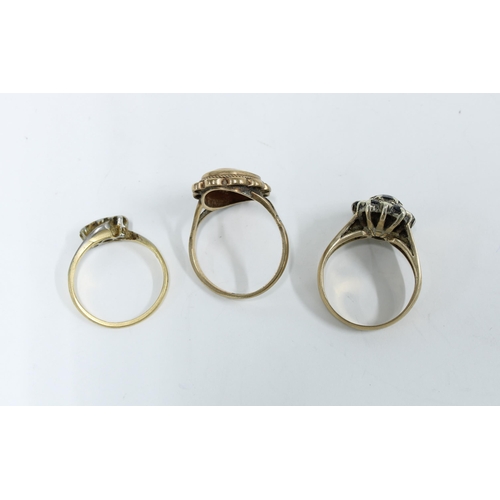 53 - Three 9ct gold rings to include a cameo ring, diamond ring and a sapphire ring (3)