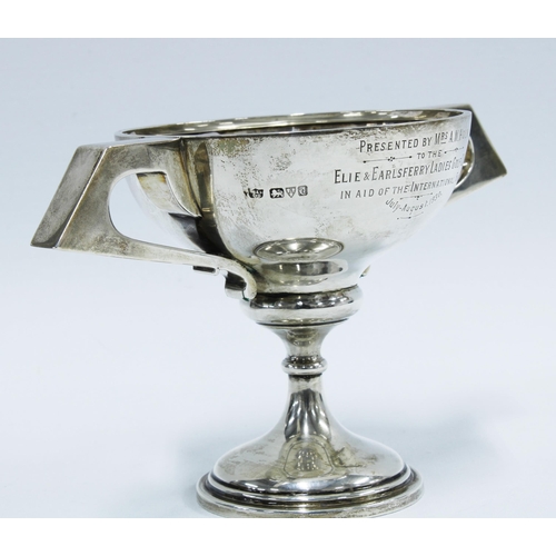 58 - George V silver trophy cup with inscription, Chester 1930,  21cm wide