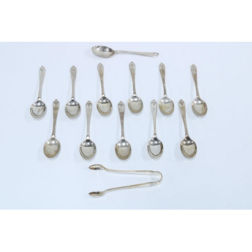 62 - Cased set of twelve Walker & Hall silver teaspoons and matching sugar tongs, Sheffield 1936