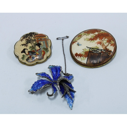 72 - Two Japanese Satsuma brooches, and a silver and enamel flowerhead brooch (3)