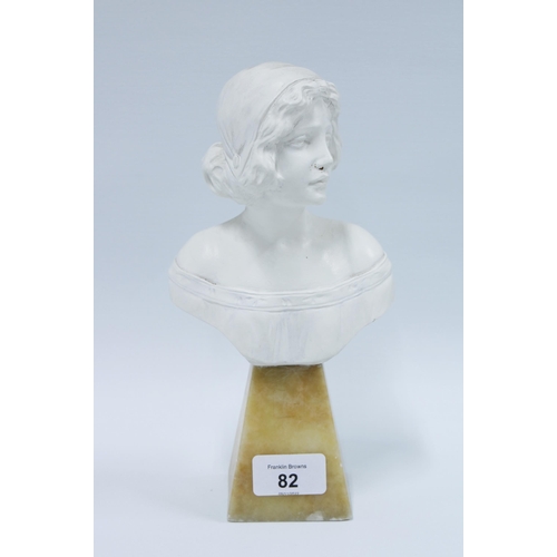 82 - White painted head and shoulders bust, on a a faux hardstone base, 24cm high.