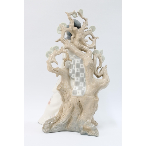 97 - Lladro porcelain figure of a Geisha beneath a prunus tree, 30cm.