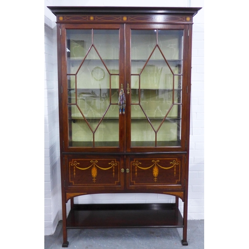 276 - Edwardian rosewood and marquetry display cabinet with a stepped cornice over a pair of astragal glaz... 