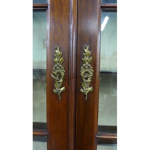 276 - Edwardian rosewood and marquetry display cabinet with a stepped cornice over a pair of astragal glaz... 