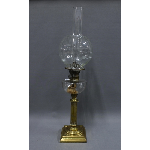 159 - Brass oil lamp with a BEC Gladiator glass well, complete with funnel and glass shade, overall height... 