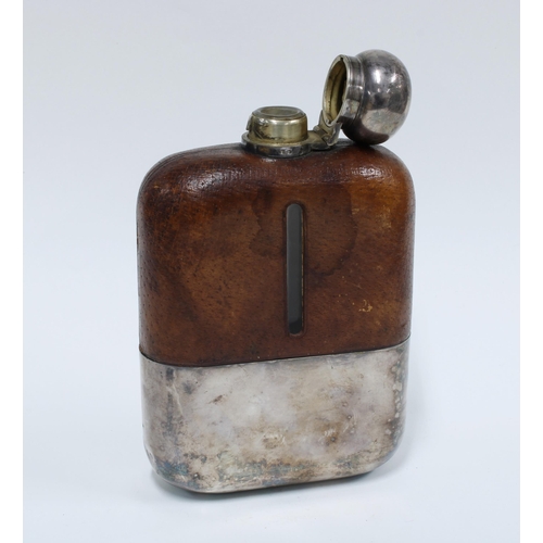 42 - Late 19th / early 20th century Epns and leather mounted glass hip flask with a hinged lid and detach... 