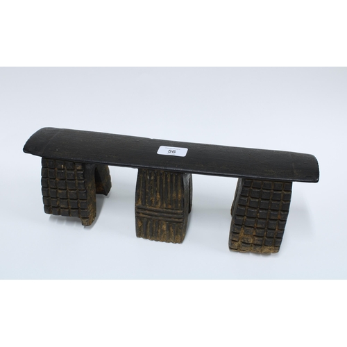 56 - South African Zulu wooden neck rest on three linear pattern supports, 39.5cm long