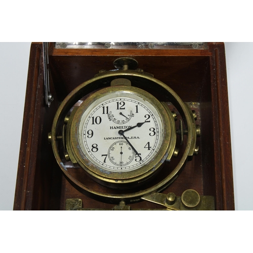 63 - Hamilton Watch Company chronometer watch, model 22, in mahogany case, numbered 276-1943, case 15 x 1... 