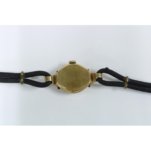 9 - Lady's 14ct gold cased wristwatch on a black cord strap