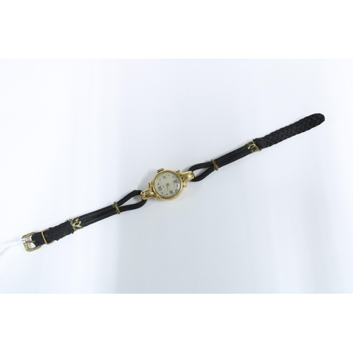 9 - Lady's 14ct gold cased wristwatch on a black cord strap