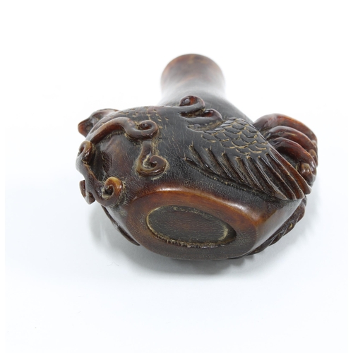 113 - Carved Chinese horn snuff bottle formed as a phoenix, 6.5cm