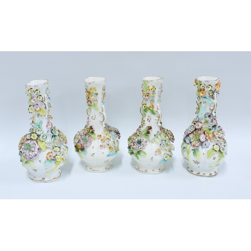 121 - Four Coalbrookdale type floral encrusted vases, (4) (some loses to petals, etc) 21cm.