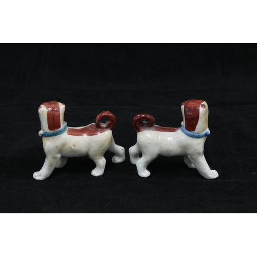 122 - Pair of porcelain dog and pup figure groups, on blue cushions bearing gold anchor backstamps, togeth... 