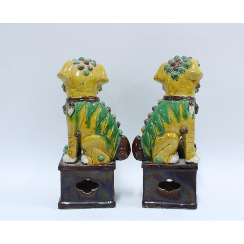 128 - A pair of Chinese yellow glazed Dog of Fo temple guardians (2) 25cm.