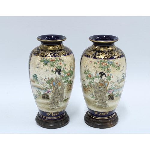 133 - Pair of Japanese satsuma vases, gilded and painted with a female in a garden, signature mark to base... 