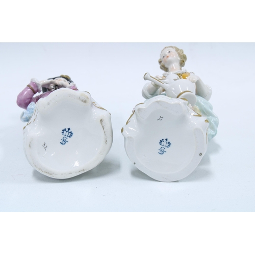 137 - A pair of Sitzendorf porcelain male and female gardening figures, (2) 17cm.