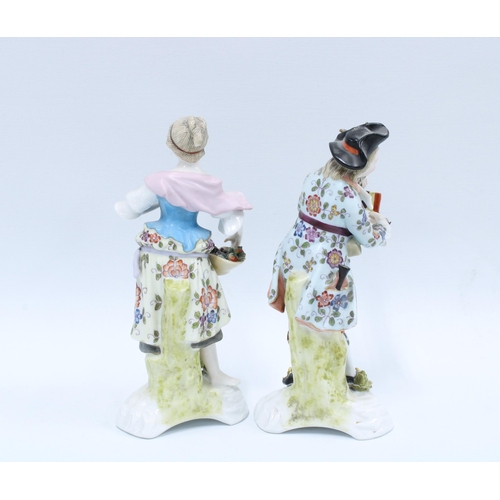 140 - A pair of Sitzendorf porcelain male and female figures, (2) 19cm.