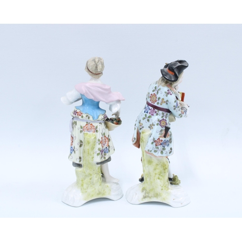 140 - A pair of Sitzendorf porcelain male and female figures, (2) 19cm.