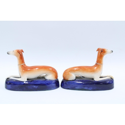 151 - A pair of 19th century Staffordshire hound pen holders (2) 13cm.