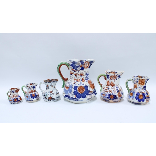 159 - Six Masons & Ironstones Imari jugs with green serpent handles, graduating size, (6) tallest 22cm, sm... 