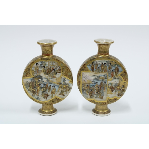 165 - A pair of Japanese Satsuma flasks, painted with figures, signed (2) 12cm.