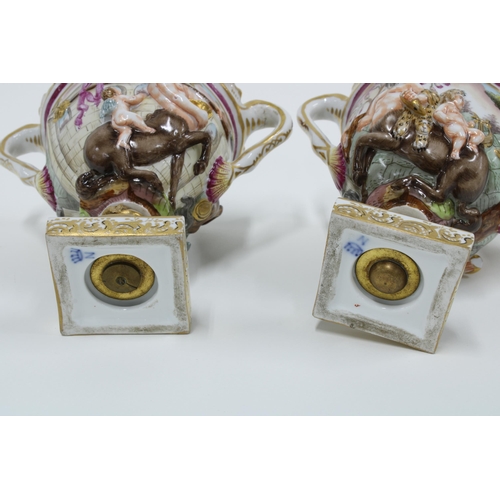 168 - A pair of Capodimonte Bacchus urn vases (2) 14cm.