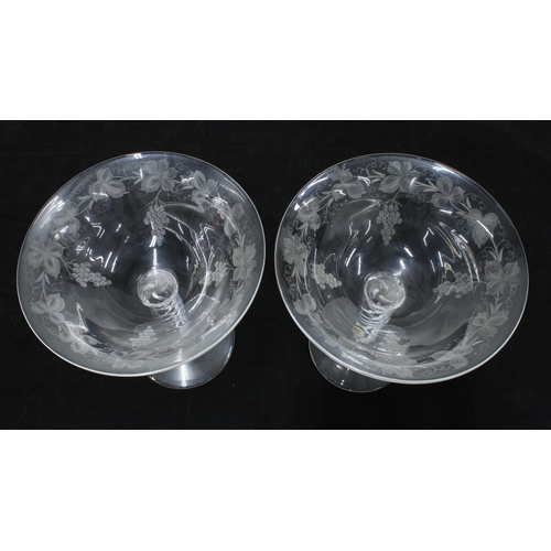 173 - A pair of fruit and vine etched glasses with spiral twist stems (2) 18cm.