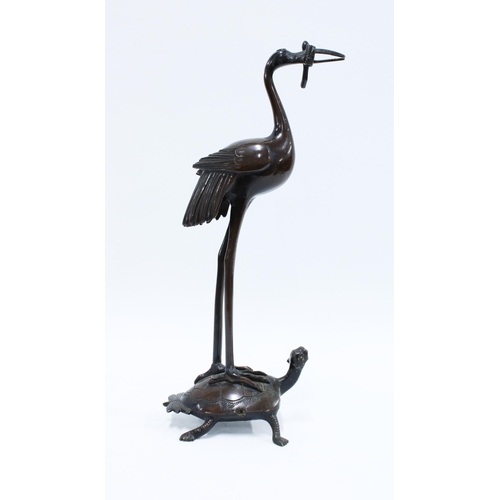 179 - Bronze stork stood upon a turtle, 30cm.