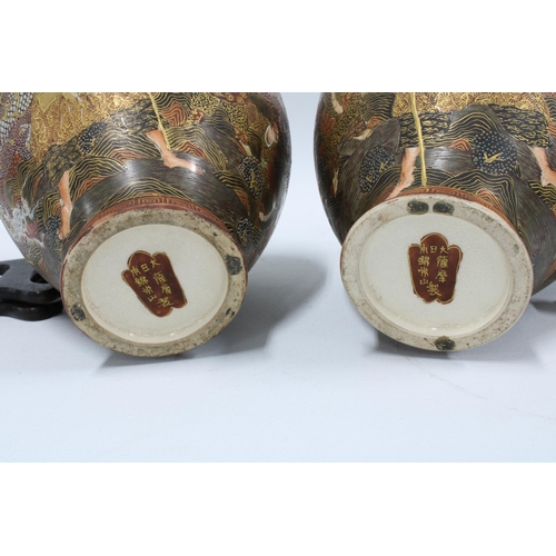 182 - Pair of  Japanese Thousand Faces earthenware vases (2) 22cm.