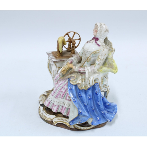 190 - 19th century porcelain figure of a woman sat in a high back chair beside a spinning wheel, blue cros... 