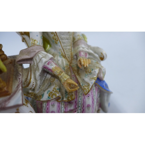 190 - 19th century porcelain figure of a woman sat in a high back chair beside a spinning wheel, blue cros... 