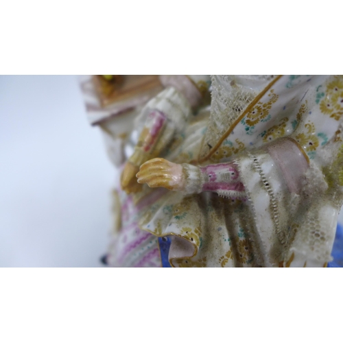 190 - 19th century porcelain figure of a woman sat in a high back chair beside a spinning wheel, blue cros... 