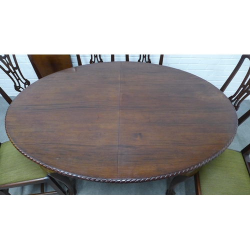 232 - Mahogany dining suite comprising table with oval top and gadrooned edge with extending leaf, on ball... 