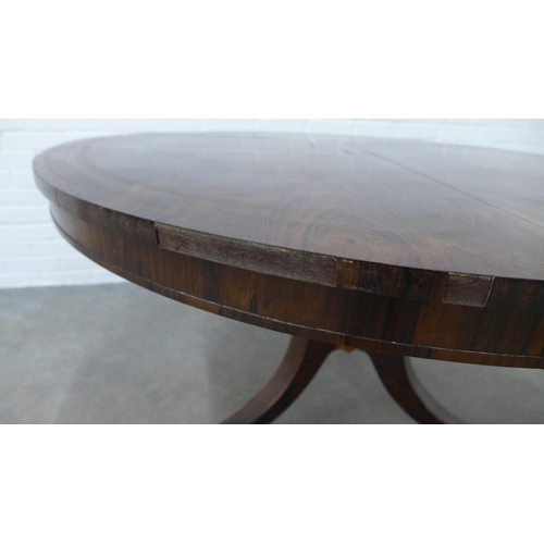 256 - 19th century rosewood breakfast table, circular tilt top on ring turned column and hipped outswept l... 