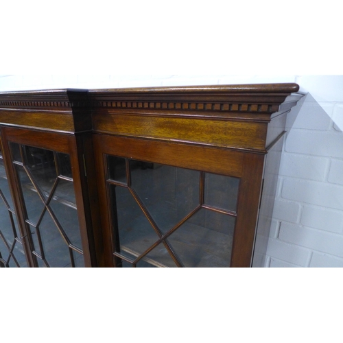 263 - Late 19th / early 20th century mahogany breakfront bookcase with four astragal glazed doors, shelved... 