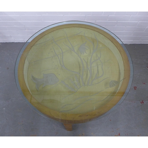 266 - Centre table with a circular glass top with etched fish pattern, removable with space beneath. 59 x ... 